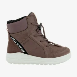 Urban snowboarder mid-cut